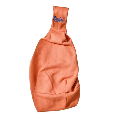 Orange cat carrier bag for outdoor travel, designed for small pets, featuring a practical crossbody style.