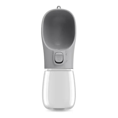 Travel water bottle for dogs with quick-dispense button