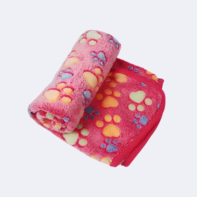 Soft cartoon pet throw blanket draped over a dog bed