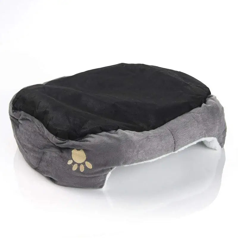 Plush pet bed with supportive padding, offering cozy rest for small puppies and kittens.