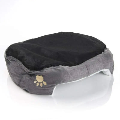 Plush pet bed with supportive padding, offering cozy rest for small puppies and kittens.