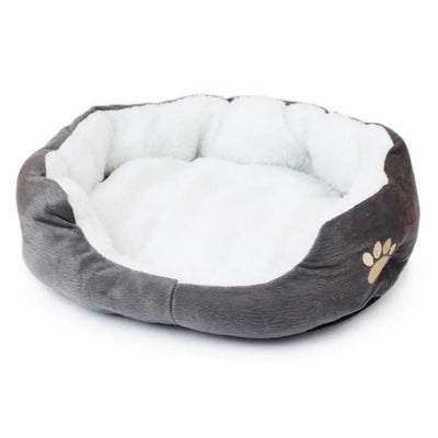 Small dog and cat bed with durable PP cotton filling, shaped for cuddling and calm naps.