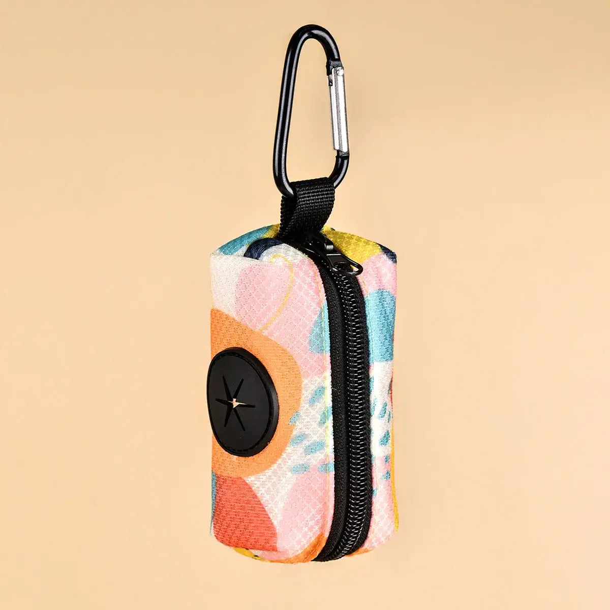 Universal designer poop bag holder attached to a dog leash outdoors