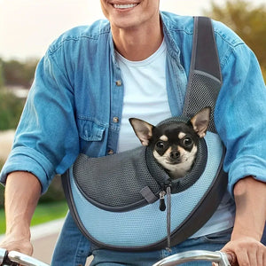 Outdoor pet carrier backpack with a small dog safely secured, perfect for biking adventures.