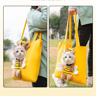 Yellow portable cat strap bag with a cute cat peeking out, perfect for outings and travel.