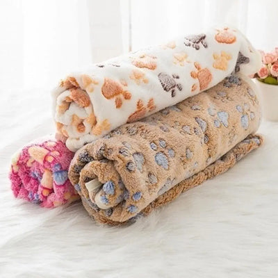 Cozy dog wrapped in a lightweight cartoon pet blanket on the couch