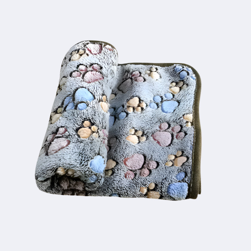 Fluffy cartoon-print blanket keeping a puppy warm and snuggled