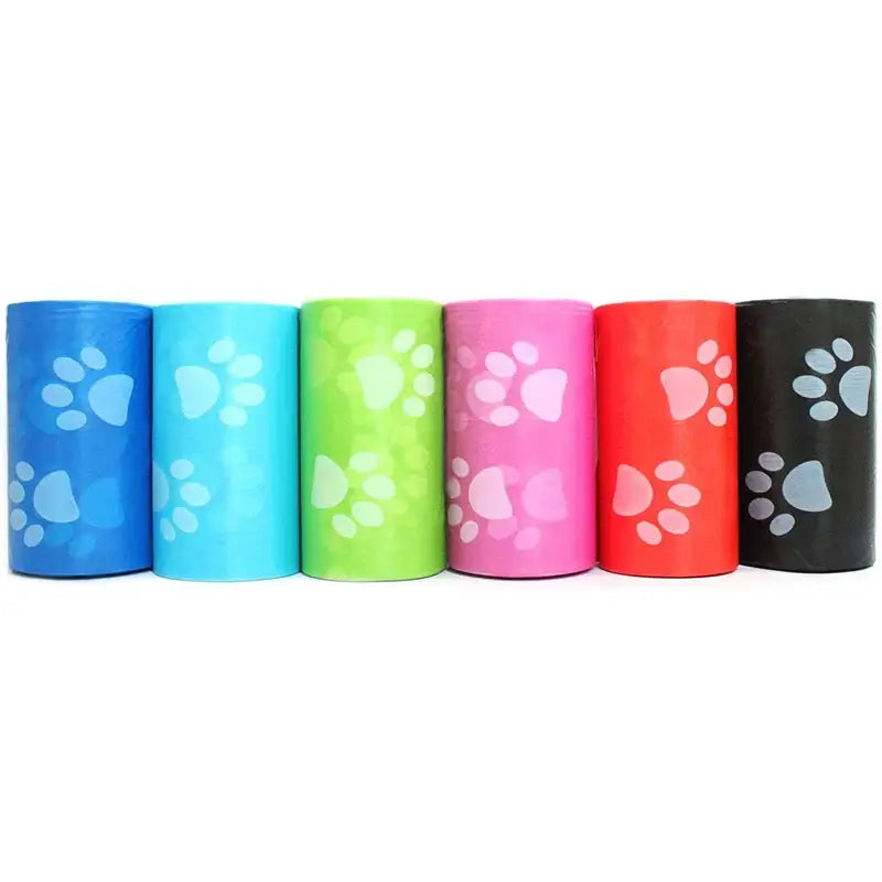 Dog waste bags in portable roll dispenser for on-the-go use