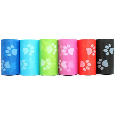 Dog waste bags in portable roll dispenser for on-the-go use