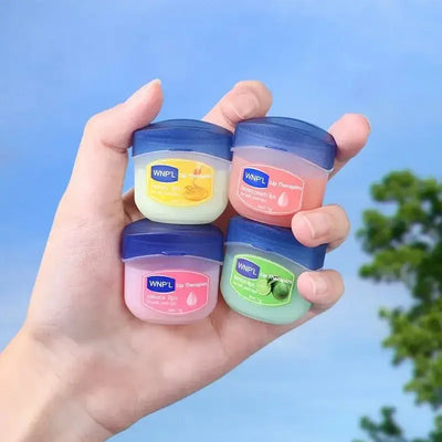 Flat‑lay of Plant‑Based Hydrating Lip Set beside aloe leaf and jojoba seeds, emphasizing clean, organic ingredients and long‑lasting hydration.